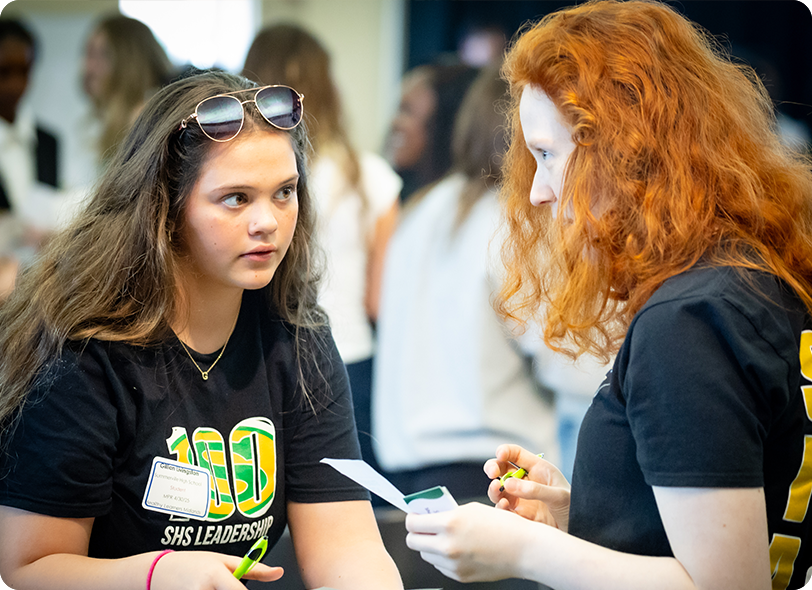 two young woman talking