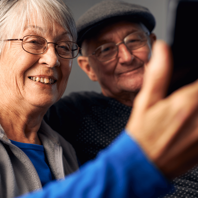 Senior Couple video calling with loved ones